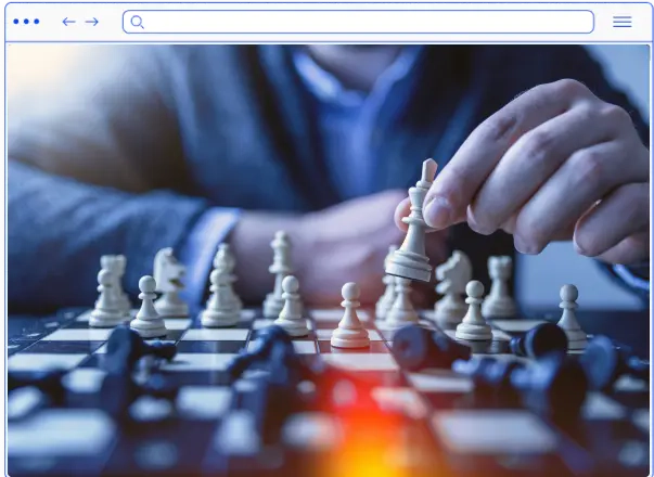 A browser in which a picture is open that depicts chess with a human hand holding a piece