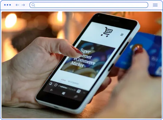 A browser in which you can see a photo of a smartphone in your hands depicting an online store